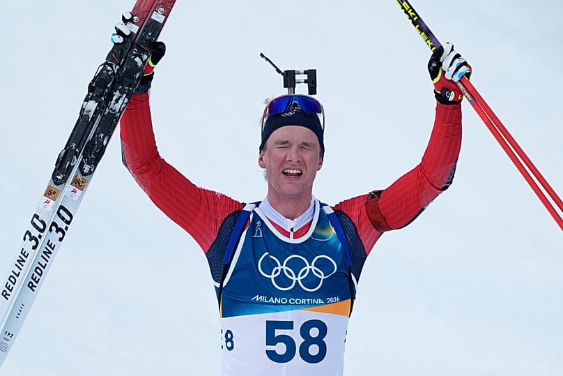 Norway’s Johan-Olav Botn reacts after winning gold in the men's 20-kilometre individual biathlon race at the 2026 Winter Olympics in Anterselva, 10 February, 2026