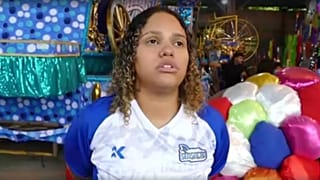 Young woman becomes first-ever drum master of a Brazilian samba school