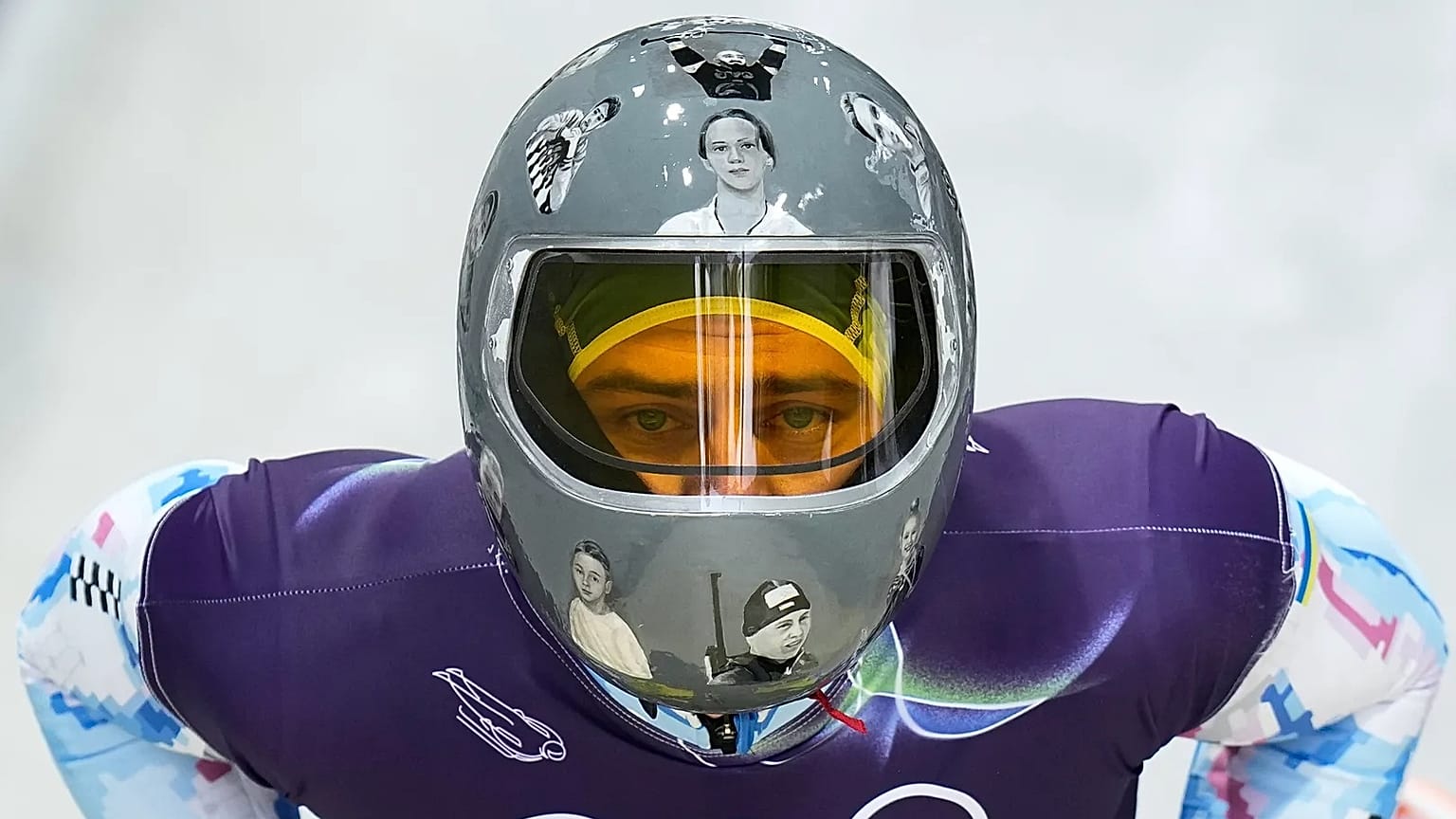 Ukraine's Vladyslav Heraskevych arrives at the finish during a men's skeleton training session at the 2026 Winter Olympics, in Cortina d'Ampezzo, Italy, Feb. 11, 2026