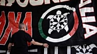 In questa foto scattata sabato 9 settembre 2017, uno striscione raffigurante una tartaruga, simbolo del movimento neofascista CasaPound, è appeso durante l'incontro nazionale 