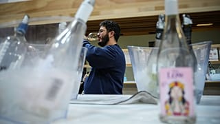 A visitor tastes non-alcoholic wine at the Wine Paris 2026 fair, at the Porte de Versailles exhibition center in Paris, France, Tuesday, Feb. 10, 2026