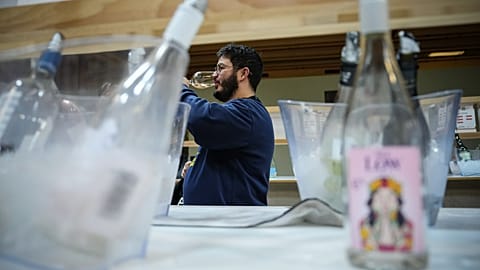 A visitor tastes non-alcoholic wine at the Wine Paris 2026 fair, at the Porte de Versailles exhibition center in Paris, France, Tuesday, Feb. 10, 2026