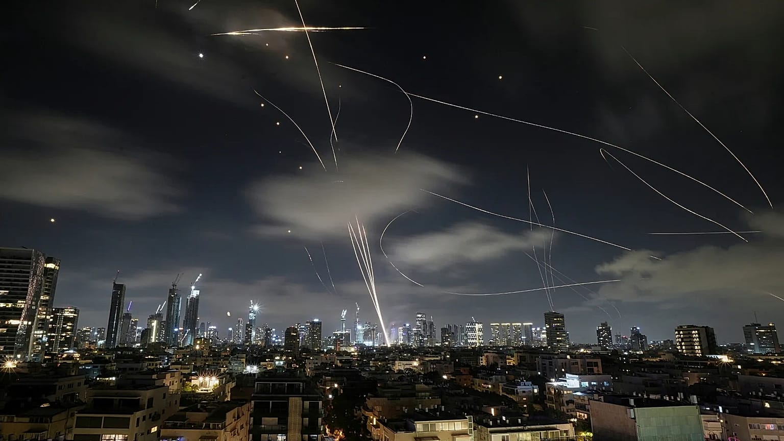 The Israeli Iron Dome air defence system intercepts missiles during an Iranian attack on Tel Aviv, 18 June, 2025