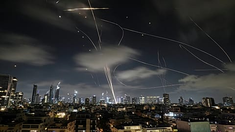 The Israeli Iron Dome air defence system intercepts missiles during an Iranian attack on Tel Aviv, 18 June, 2025