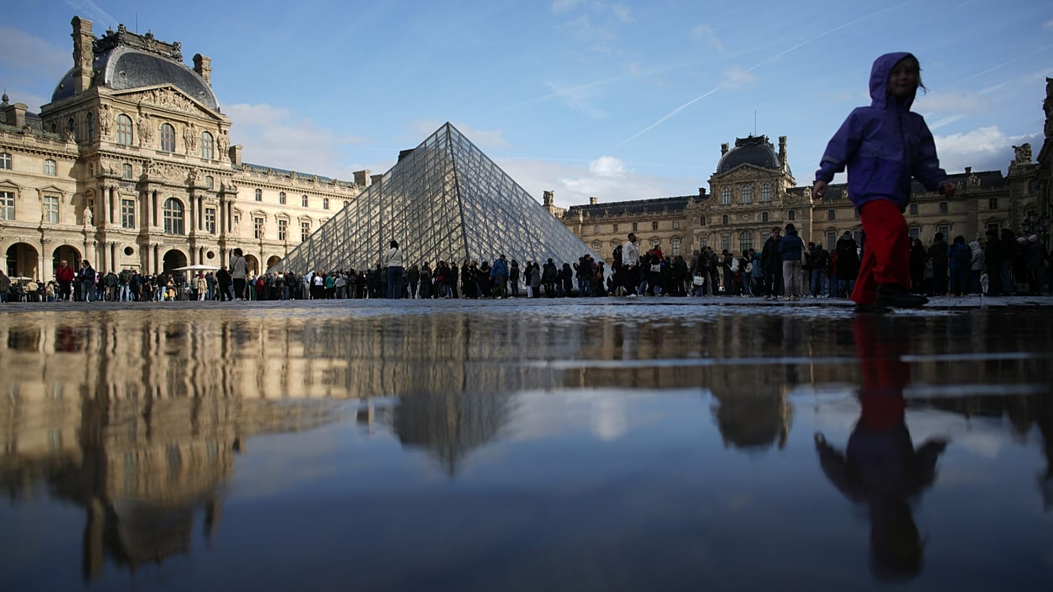 FILE - People queue to enter the Louvre museum Monday, Oct. 27, 2025 in Paris.