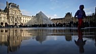 FILE - People queue to enter the Louvre museum Monday, Oct. 27, 2025 in Paris.