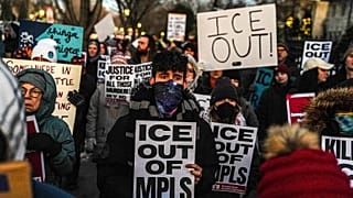 People participate in an anti-ICE protest outside of the Governors Residence in St Paul, 6 February, 2026