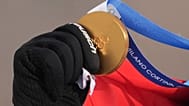 Austria's Alessandro Haemmerle holds his gold medal after winning the men's snowboard cross finals at the 2026 Winter Olympics, in Livigno, Italy, Thursday, Feb. 12, 2026.