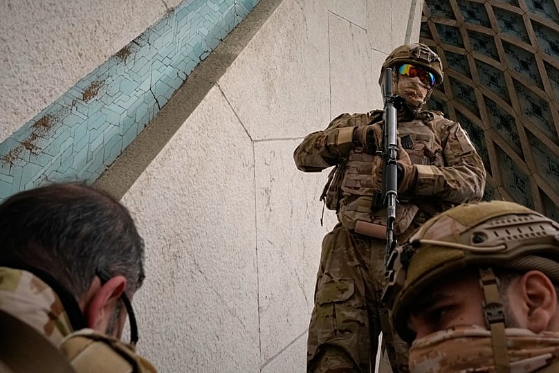 FILE: Members of Iran's Revolutionary Guard stand guard during the rally commemorating the 1979 Islamic Revolution at Azadi Square in Tehran, 11 February 2026