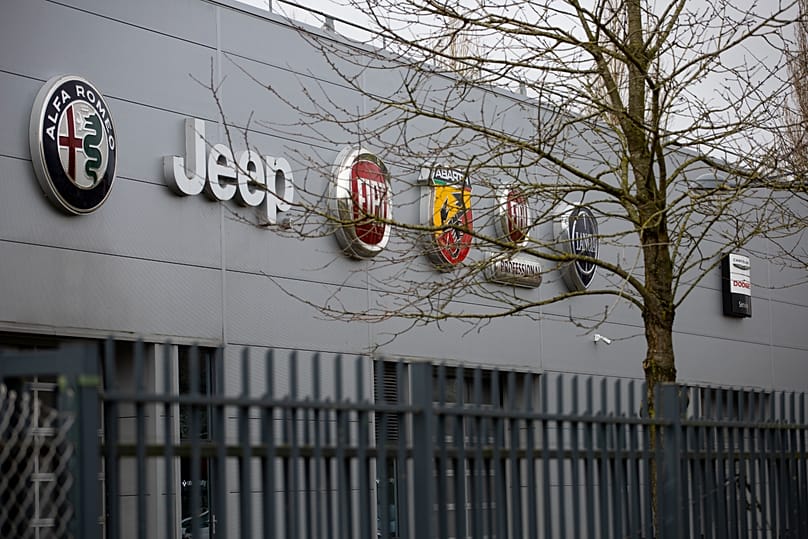 FILE. Car brand logos are seen on the facade of the Stellantis headquarters near Amsterdam, January 2021