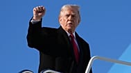 President Donald Trump gestures as he boards Air Force One at Pope Army Airfield, in Fort Bragg, N.C., Friday, Feb. 13, 2026, en route to Palm Beach, Fla. (AP Photo/Matt Rourk