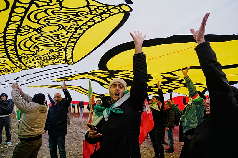 Supports of Iran's exiled Crown Prince Reza Pahlavi attend a demonstration during the Munich Security Conference in Munich, Germany, Saturday, Feb. 14, 2026