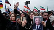 Supports of Iran's exiled Crown Prince Reza Pahlavi attend a demonstration during the Munich Security Conference in Munich