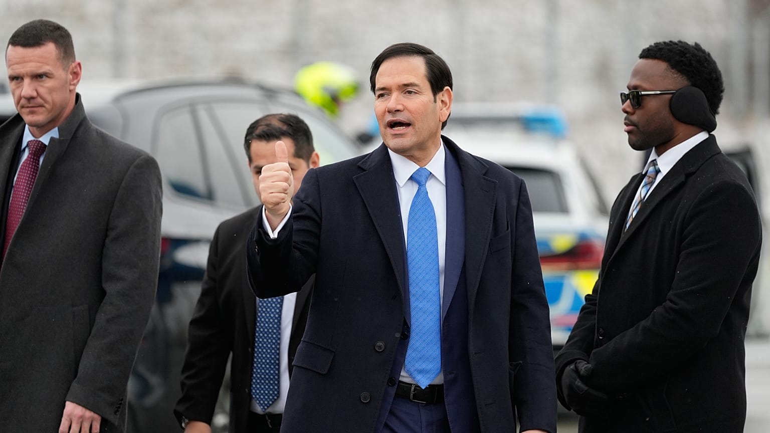 U.S. Secretary of State Marco Rubio gives a thumbs up as he departs Munich International Airport in Munich, Germany
