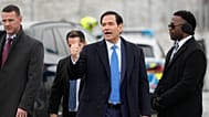 U.S. Secretary of State Marco Rubio gives a thumbs up as he departs Munich International Airport in Munich, Germany