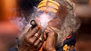 A holy man smokes marijuana at the Pashupatinath Hindu temple during Shivaratri festival in Kathmandu