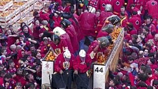 Streets of Ivrea explode with flying oranges in a three-day carnival revolt