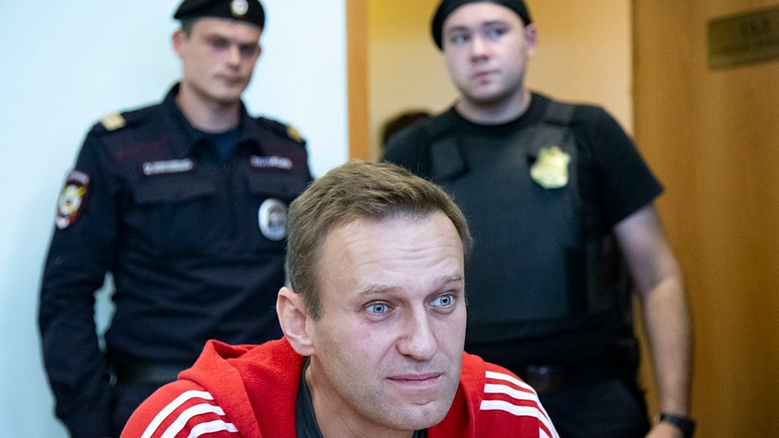 FILE: Russian opposition leader Alexei Navalny speaks to the media prior to a court session in Moscow, 22 August 2018