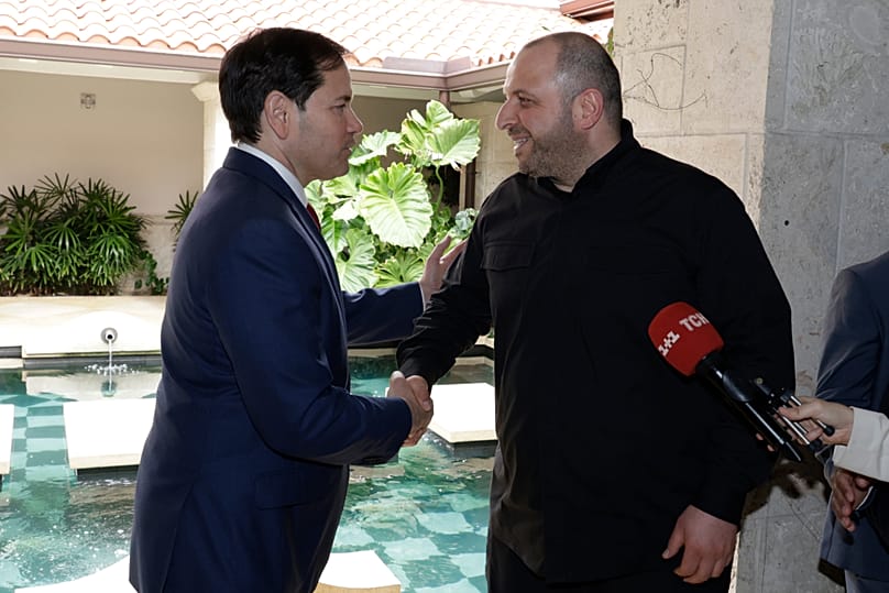FILE - U.S. Secretary of State Marco Rubio, left, and Ukraine's Secretary of National Security Rustem Umerov shake hands, on Nov. 30, 2025, in Hallandale Beach, Fla
