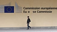 A man walks in front of the European Commission