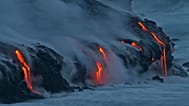 FILE:Lava from Kilauea volcano in Hawaii Volcanoes National Park enters the Pacific Ocean at dawn Wednesday, Feb. 2, 2005