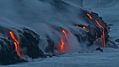 FILE:Lava from Kilauea volcano in Hawaii Volcanoes National Park enters the Pacific Ocean at dawn Wednesday, Feb. 2, 2005