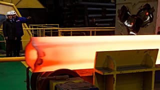 Former Russian Prime Minister Dmitry Medvedev visits the Seversky Tube Works in the town of Polevskoy, Russia,, Oct. 24, 2014.