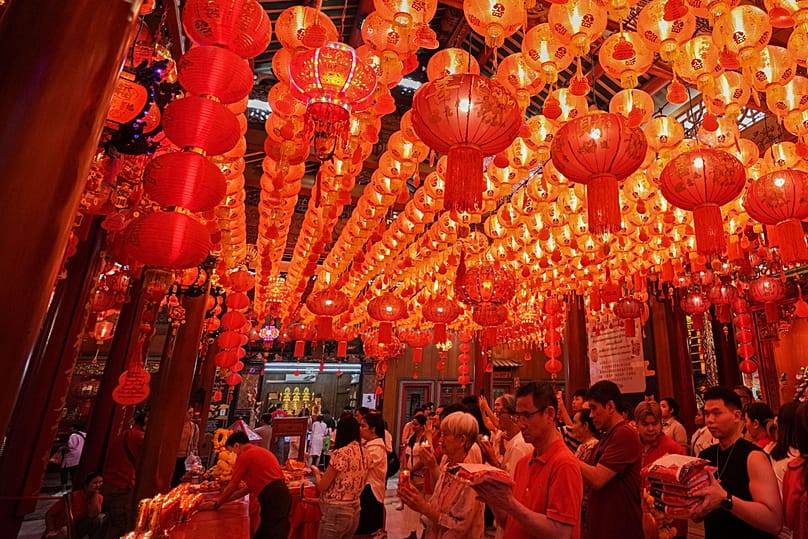 Ethnic Chinese Thais pray at the Leng Nuei Yee Chinese temple ahead of Chinese Lunar New Year in Bangkok, Thailand, Monday, Feb. 16, 2026. (AP Photo/Sakchai Lalit)