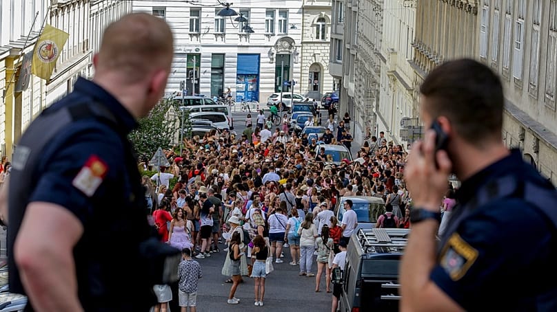 FILE: Austrian police officers watch swifts gathering in the city centre in Vienna, Austria, on 8 August, 2024.