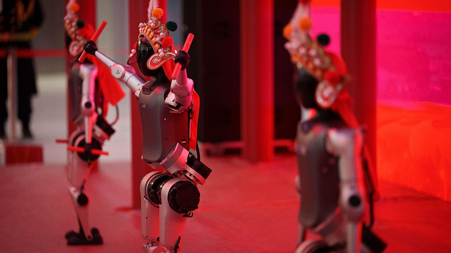 Humanoid robots perform during the media preview of a robotic temple fair celebrated ahead of Lunar New Year, 13 February 2026. 