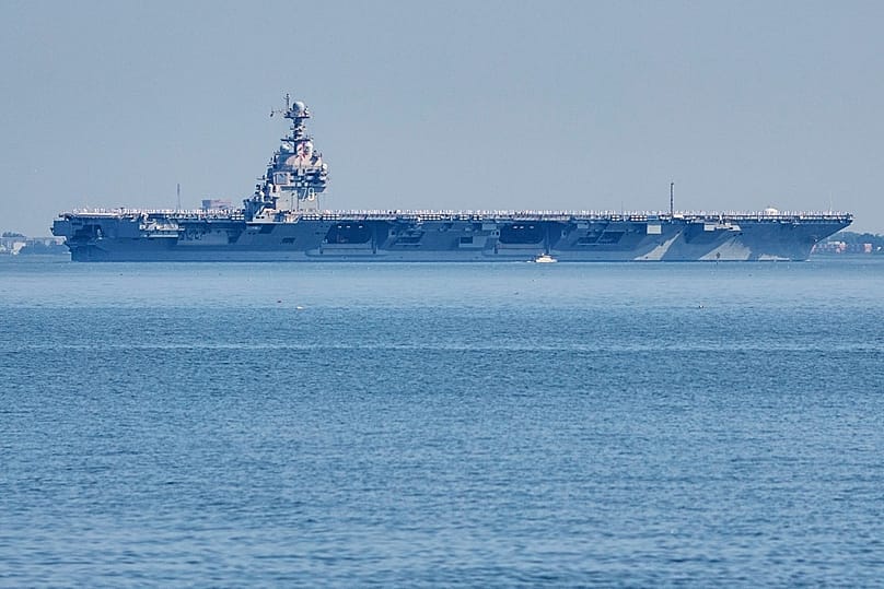 FILE The USS Gerald R. Ford aircraft carrier leaves Naval Station Norfolk, June 23, 2025, in Norfolk, Va. (AP Photo/John Clark, File)