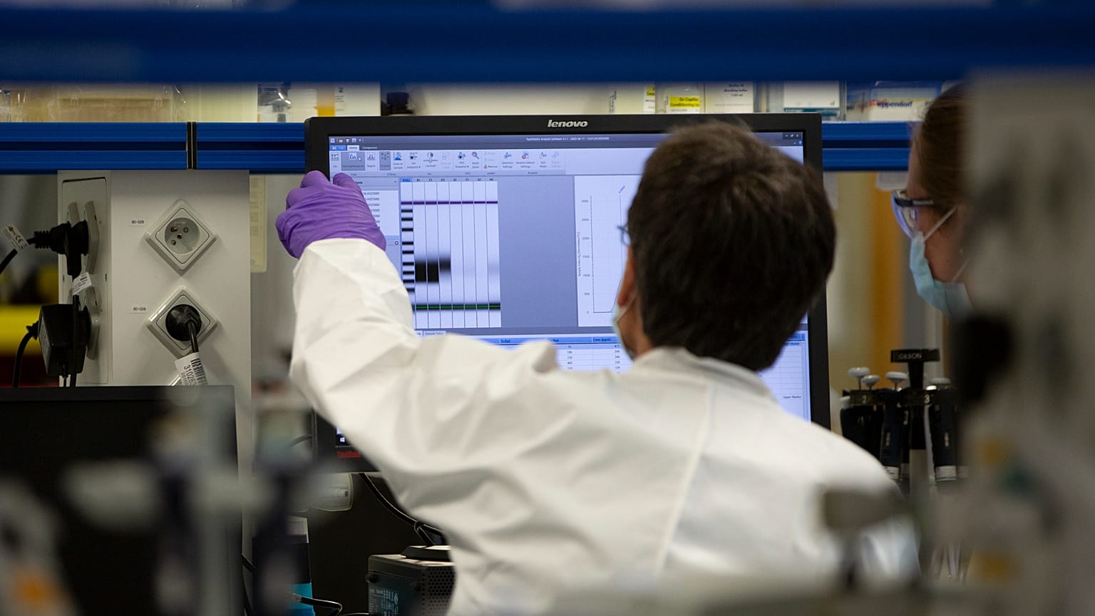 FILE: A lab technician looks at a computer screen during research on coronavirus, COVID-19 in Belgium.