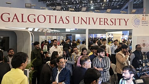 People visit Galgotias University stall at AI summit ahead of an eviction order issued by Indian authorities, in New Delhi, India, Wednesday, Feb. 18, 2026