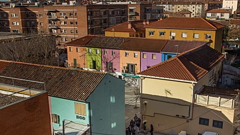 Riot police cordon the area, block and identify housing right activists during Emilia Montoya Vazquez and her family's eviction in Madrid, Spain, Wednesday, Feb. 25, 2015.