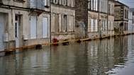 View of a flooded street of Saintes as severe flooding hits western France amid storm Pedro, Wednesday, Feb. 18, 2026.