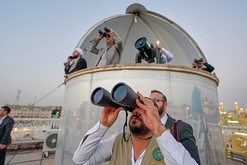 Shiites observe the crescent moon to determine the start of the ninth Islamic month of Ramadan in Najaf, Iraq