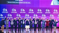 India's Prime Minister Narendra Modi, seventh left, poses for photographs with chief executive officers of various AI groups during the AI Summit in New Delhi, India, Thursday