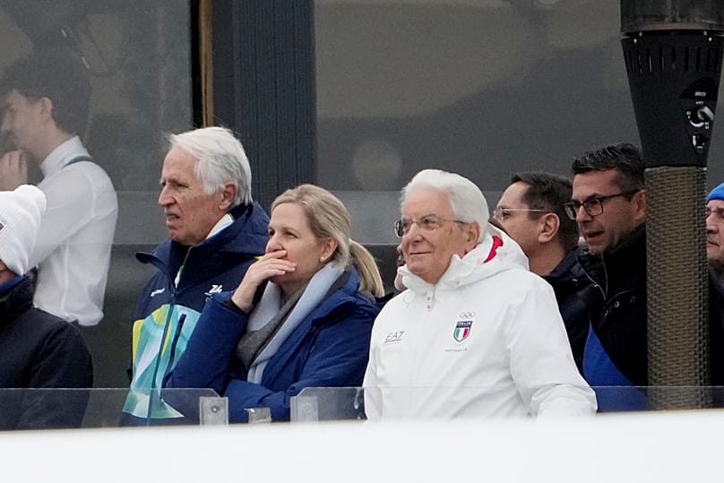 Italian President Sergio Mattarella and ICC President Kirsty Coventry watch an alpine ski super-G race at the 2026 Winter Olympics, in Cortina d'Ampezzo, 19 February 2026
