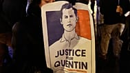 A woman holds a placard paying tribute to right-wing student Quentin Deranque in Lille, France 