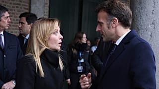 FILE: Italy's Prime Minister Giorgia Meloni speaks with French President Emmanuel Macron during the EU summit at Alden Biesen Castle in Bilzen-Hoeselt, 12 February 2026