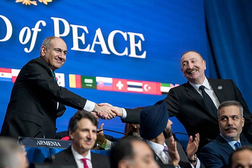 President of Azerbaijan, Ilham Aliyev, and Armenian Prime Minister, Nikol Pashinyan, shaking hands during the session
