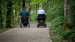 FILE: David Allgood and Tom Stokes use a trail adapted for persons with disabilities at Mammoth Cave National Park in Cave City.