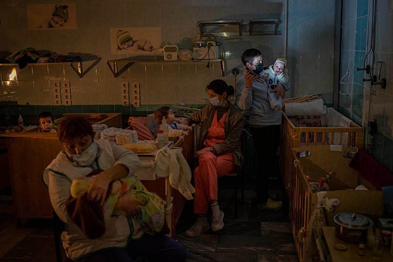 FILE - Hospital staff take care of orphaned children at the children's regional hospital maternity ward in Kherson, southern Ukraine, Tuesday, Nov. 22, 2022.