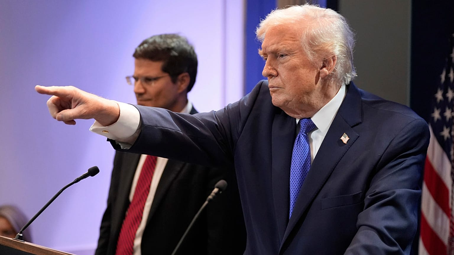 US President Donald Trump points to a reporter during a press briefing at the White House in Washington, 20 February 2026