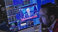 US President Donald Trump appears on a trader's screen on the floor of the New York Stock Exchange, 20 February 2026