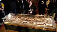 Journalists record the remains of Francis of Assisi inside the Basilica of St Francis of Assisi in Assisi, Italy 21 Feb 2026