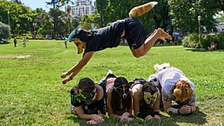 A youth jumps over other therians, people who say they identify as non-human animals, during a gathering in Buenos Aires, Argentina, 22 Feb 2026