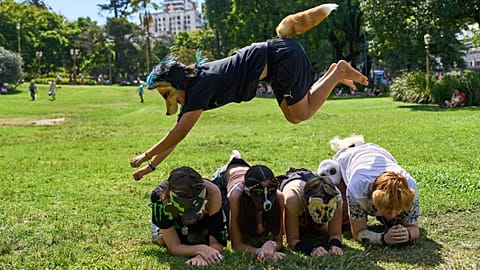 A youth jumps over other therians, people who say they identify as non-human animals, during a gathering in Buenos Aires, Argentina, 22 Feb 2026
