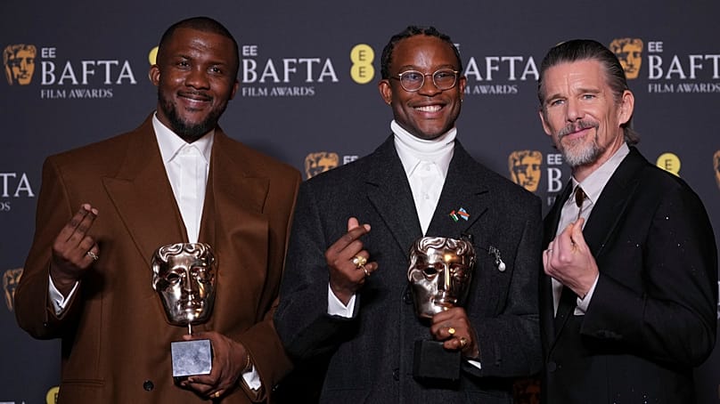 From left: Wale Davies, Akinola Davies Jr., and Ethan Hawke with the outstanding debut by a British writer, director or producer award for 'My Father's Shadow', 22 Feb 2026