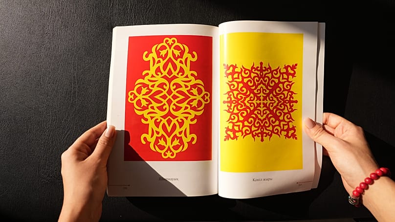 “Secrets of the ornament” book is often used by Sabyrbayeva and her clients to choose the design and understand the meaning behind each ornament.